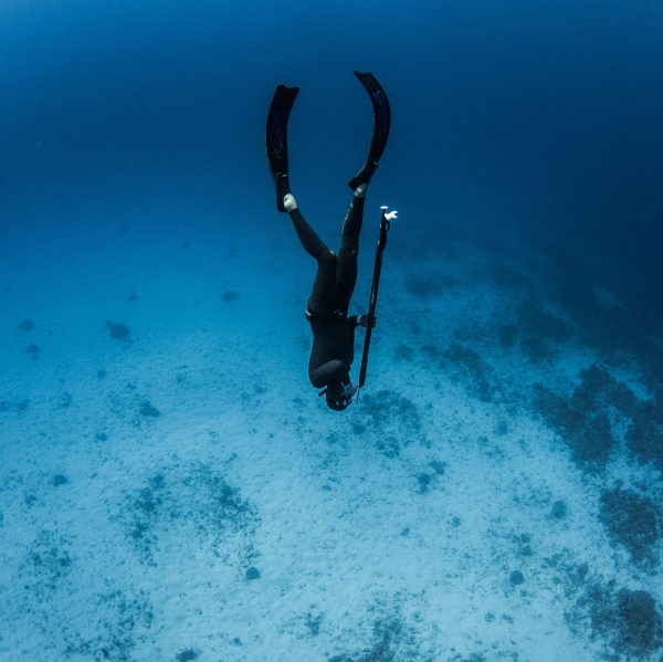 instructor teaches underwater